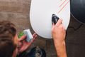 man is waxing a snowboard man is waxing a snowboard - PhotoDune Item for Sale