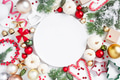 Christmas Pattern with Empty White Plate and Festive Decoration Christmas Pattern with Empty White Plate and Festive Decoration - PhotoDune Item for Sale