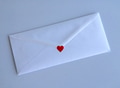 Love letter. White envelope with red heart on white background. Minimalistic background. Love letter. White envelope with red heart on white background. Minimalistic background. - PhotoDune Item for Sale