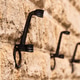 Close-Up of Metal Hooks on Stone Wall Close-Up of Metal Hooks on Stone Wall - PhotoDune Item for Sale