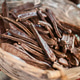 Carob pods in wicker basket. Carob pods in wicker basket. - PhotoDune Item for Sale