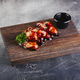 Chicken wings in teriyaki sauce on wooden cutting board Chicken wings in teriyaki sauce on wooden cutting board - PhotoDune Item for Sale