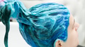 Hairdresser Holds Long Blue Hair in Hand While Washing Hair After Process Dyeing Hair in Blue Color Hairdresser Holds Long Blue Hair in Hand While Washing Hair After Process Dyeing Hair in Blue Color - PhotoDune Item for Sale