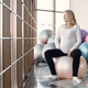 Pregnant woman doing fitness excercise in bright fitness studio Pregnant woman doing fitness excercise in bright fitness studio - PhotoDune Item for Sale