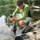 Man is filtering water from the lake for
human consumption. Camping off the grid
in wilderness Man is filtering water from the lake for
human consumption. Camping off the grid
in wilderness - PhotoDune Item for Sale