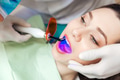 Close-up portrait of a pretty girl getting teeth bleached Close-up portrait of a pretty girl getting teeth bleached - PhotoDune Item for Sale