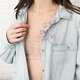 woman wearing denim jacket showing beige bra underwear, dry flowers in a pocket of a jacket. woman wearing denim jacket showing beige bra underwear, dry flowers in a pocket of a jacket. - PhotoDune Item for Sale