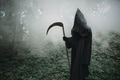 Death with a scythe in the dark misty forest Death with a scythe in the dark misty forest - PhotoDune Item for Sale
