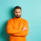 Silly sad guy with beard, sulking and looking offended, cross arms on chest and frowning upset Silly sad guy with beard, sulking and looking offended, cross arms on chest and frowning upset - PhotoDune Item for Sale