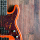 orange electric bass guitar on wood background orange electric bass guitar on wood background - PhotoDune Item for Sale