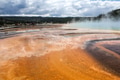 Yellowstone National Park landscape with active geyser steam and mountains in background Yellowstone National Park landscape with active geyser steam and mountains in background - PhotoDune Item for Sale