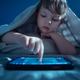 Child using tablet or smartphone at night Child using tablet or smartphone at night - PhotoDune Item for Sale