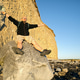 Man standing on rock cliff with raised arms celebrating freedom adventure coastal landscape Man standing on rock cliff with raised arms celebrating freedom adventure coastal landscape - PhotoDune Item for Sale