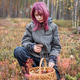 Girl foraging wild mushrooms in autumn forest Girl foraging wild mushrooms in autumn forest - PhotoDune Item for Sale