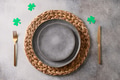 St Patrick's Day party table setting with green decor on gray background. St Patrick's Day party table setting with green decor on gray background. - PhotoDune Item for Sale