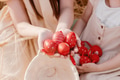 Two little girls sisters sitting in wheat field collecting red eggs in basket. Celebrating Easter Two little girls sisters sitting in wheat field collecting red eggs in basket. Celebrating Easter - PhotoDune Item for Sale