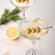 Dry Martini Served in Glasses With Olives and Lemon on a Table Dry Martini Served in Glasses With Olives and Lemon on a Table - PhotoDune Item for Sale