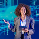 Woman presents with a tablet in front of a blue digital background at a conference Woman presents with a tablet in front of a blue digital background at a conference - PhotoDune Item for Sale