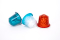 Multi colour coffee capsules on white background Multi colour coffee capsules on white background - PhotoDune Item for Sale