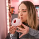Enjoying a delicious donut with cherry topping in a cozy cafe setting Enjoying a delicious donut with cherry topping in a cozy cafe setting - PhotoDune Item for Sale