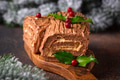 Christmas yule log cake. Traditional chocolate dessert Christmas yule log cake. Traditional chocolate dessert - PhotoDune Item for Sale