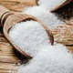 Salt background . On wooden table. Salt background . On wooden table. - PhotoDune Item for Sale