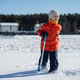 Child in winter clothes shoveling snow outdoors Child in winter clothes shoveling snow outdoors - PhotoDune Item for Sale
