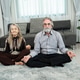 Retired couple meditating at home. Retired couple meditating at home. - PhotoDune Item for Sale