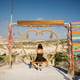 Woman on swing with heart-shaped frame in scenic landscape Woman on swing with heart-shaped frame in scenic landscape - PhotoDune Item for Sale