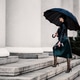 Young woman under an umbrella walking the stair Young woman under an umbrella walking the stair - PhotoDune Item for Sale