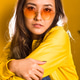 A close-up portrait of a girl wearing yellow glasses on a yellow background A close-up portrait of a girl wearing yellow glasses on a yellow background - PhotoDune Item for Sale