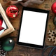 Christmas holiday decor with tablet computer blank screen mock up Christmas holiday decor with tablet computer blank screen mock up - PhotoDune Item for Sale
