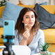 Female streamer recording video for her followers. Female streamer recording video for her followers. - PhotoDune Item for Sale