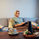 Middle aged woman planning goals for next new year while sitting on the sofa at home Middle aged woman planning goals for next new year while sitting on the sofa at home - PhotoDune Item for Sale