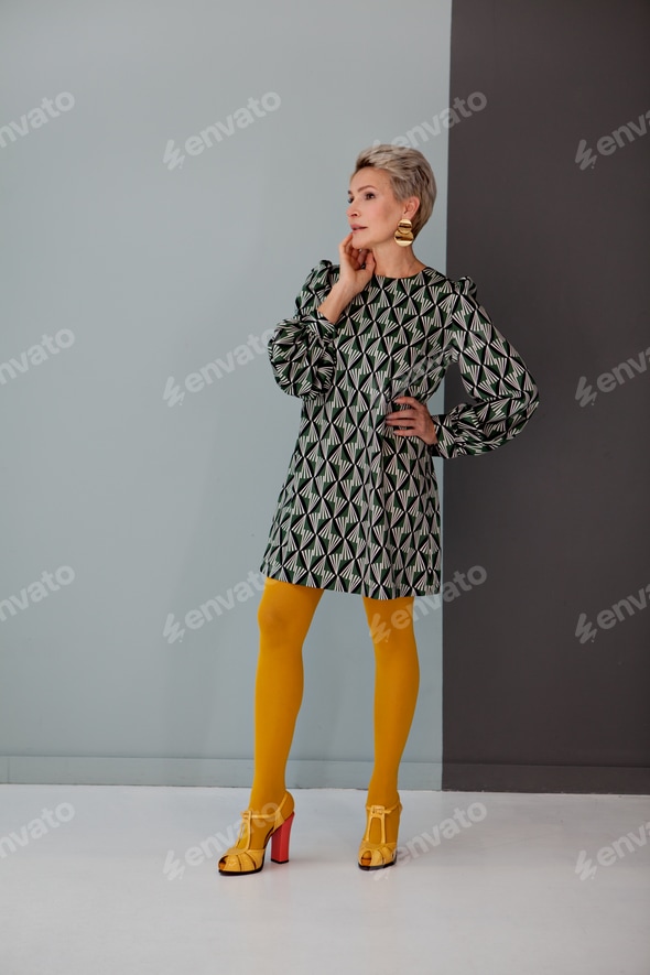 mature woman in short dress Funny Mature Woman in Mini Dress Stock Image