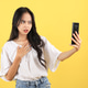 Indonesian Female Teenager Shocked and Sad Expression Looking at Mobile Phone Indonesian Female Teenager Shocked and Sad Expression Looking at Mobile Phone - PhotoDune Item for Sale