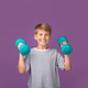 Happy smiling blond boy using fitness equipment, holding green dumbbell, building arm muscle Happy smiling blond boy using fitness equipment, holding green dumbbell, building arm muscle - PhotoDune Item for Sale