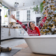 Happy woman in Santa hat is lying resting in New bathtub under Christmas tree as New Year Happy woman in Santa hat is lying resting in New bathtub under Christmas tree as New Year - PhotoDune Item for Sale