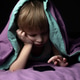 Little boy playing phone under a blanket Little boy playing phone under a blanket - PhotoDune Item for Sale