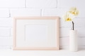 Wooden landscape frame mockup with soft yellow orchid in vase Wooden landscape frame mockup with soft yellow orchid in vase - PhotoDune Item for Sale