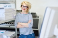 Smiling printing operator near shelves Smiling printing operator near shelves - PhotoDune Item for Sale