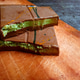 Gourmet Milk Chocolate Bars with Creamy Pistachio Filling on a Rustic Wooden Board Gourmet Milk Chocolate Bars with Creamy Pistachio Filling on a Rustic Wooden Board - PhotoDune Item for Sale