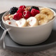 Oatmeal with fresh berries, nuts, and banana fruit. Healthy food concept. Oatmeal with fresh berries, nuts, and banana fruit. Healthy food concept. - PhotoDune Item for Sale