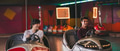 Two young friends riding bumper cars at amusement park Two young friends riding bumper cars at amusement park - PhotoDune Item for Sale