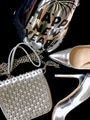 Silver shoes a handbag & Happy New Year party hat flat lay on dark background welcoming the new year Silver shoes a handbag & Happy New Year party hat flat lay on dark background welcoming the new year - PhotoDune Item for Sale
