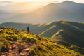 Girl on mountain peak with looking at beautiful mountain valley Girl on mountain peak with looking at beautiful mountain valley - PhotoDune Item for Sale