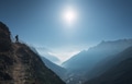 Standing young woman on the hill and looking on mountains Standing young woman on the hill and looking on mountains - PhotoDune Item for Sale