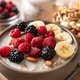 Oatmeal with fresh berries, nuts, and banana fruit. Healthy food concept. Oatmeal with fresh berries, nuts, and banana fruit. Healthy food concept. - PhotoDune Item for Sale