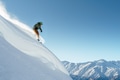 snowboarder rides on steep mountainside on a beautiful landscape snowboarder rides on steep mountainside on a beautiful landscape - PhotoDune Item for Sale