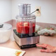Woman making cranberry orange relish in a food processor for Thanksgiving Woman making cranberry orange relish in a food processor for Thanksgiving - PhotoDune Item for Sale